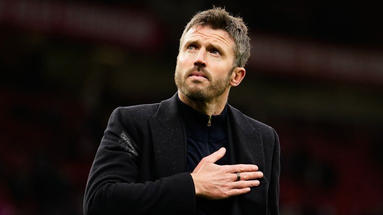 Manchester United's head coach Michael Carrick reacts to supporters after the loss to Bournemouth
