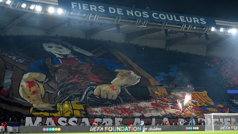 Barcelona fans unveil a tifo at the Parc des Princes