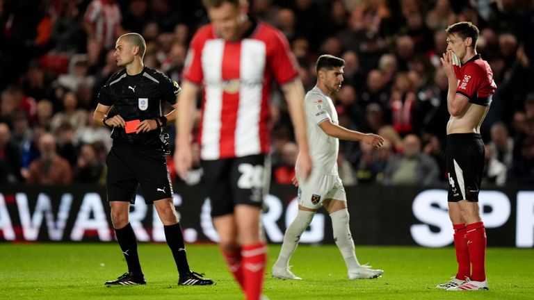 Lincoln City's Conor McGrandles reacts after being shown a red card