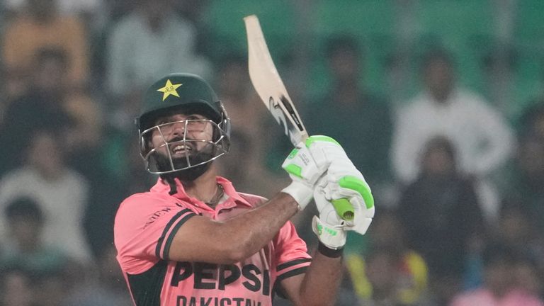 Pakistan's Shadab Khan follows the ball after hitting a six