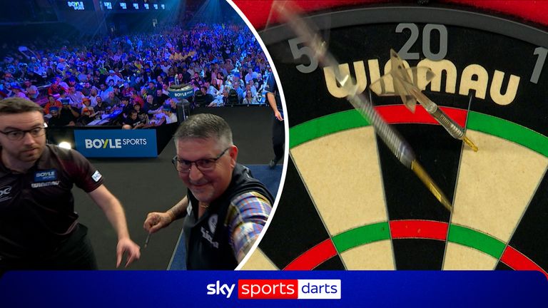 Gary Anderson sees the humorous side as he misses a double on his first three darts hitting the one and the next two darts hitting the board. With the format in the World Grand Prix players have to start on a double. 