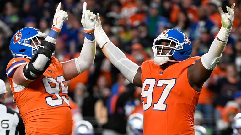 Denver Broncos defensive end Zach Allen and defensive tackle Malcolm Roach, right, react after Allen sacked Seattle Seahawks quarterback Sam Darnold during the second half of an NFL football game in Denver, Thursday, Oct. 15, 2026. (AP Photo/Geneva Heffernan)