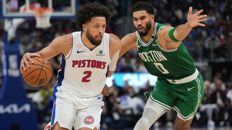 Detroit Pistons guard Cade Cunningham (2) drives on Boston Celtics forward Jayson Tatum (0) in the second half of an NBA basketball game in Detroit, Tuesday, Oct. 20, 2026. (AP Photo/Paul Sancya)
