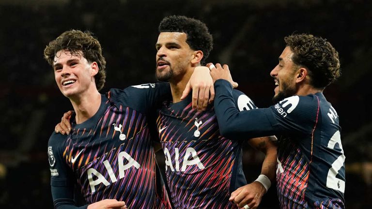 Dominic Solanke celebrates with his team-mates Omar Marmoush and Archie Gray after scoring a late equaliser (AP Photo/Dave Thompson)