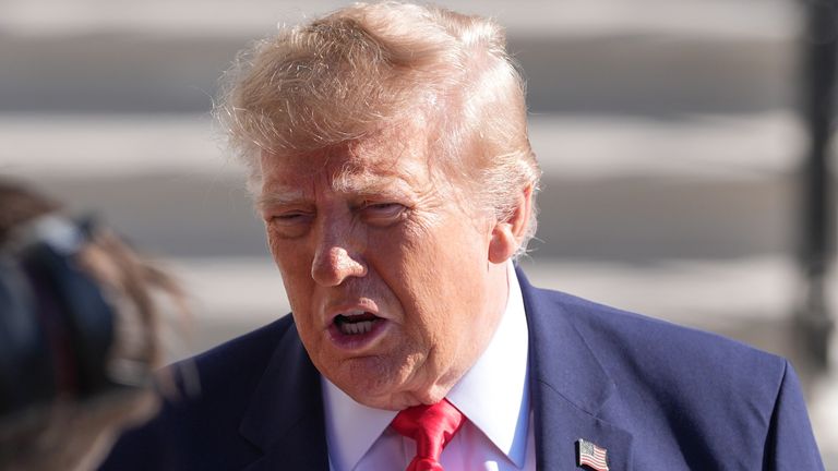 President Donald Trump speaks with reporters before departing on Marine One from the South Lawn of the White House, Friday, Oct. 23, 2026, in Washington. (AP Photo/Alex Brandon)