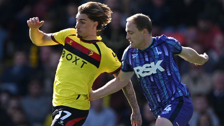 Iker Bravo is challenged by Oliver Skipp 