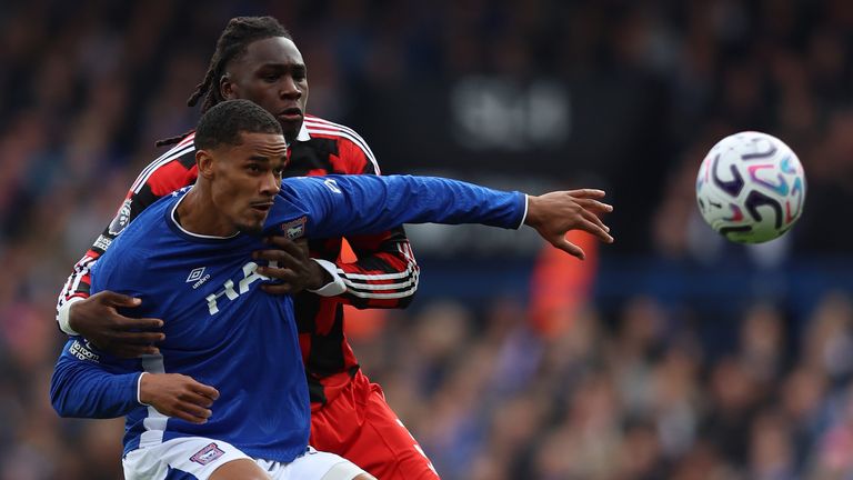 Emersonn of Ipswich Town is challenged by Calvin Bassey of Fulham