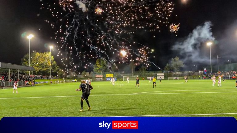 fireworks launched onto pitch