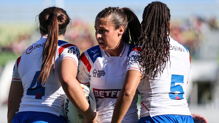 England's Jenna Foubister congratulates Connie Boyd on her try against Wales.
