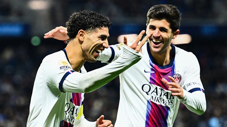 PSG's Moroccan defender #02 Achraf Hakimi (L) celebrates with PSG's Brazilian defender #04 Lucas Beraldo after scoring his team's fifth goal during the French L1 football match between Le Havre Athletic Club and Paris Saint-Germain (PSG) at Stade Oce