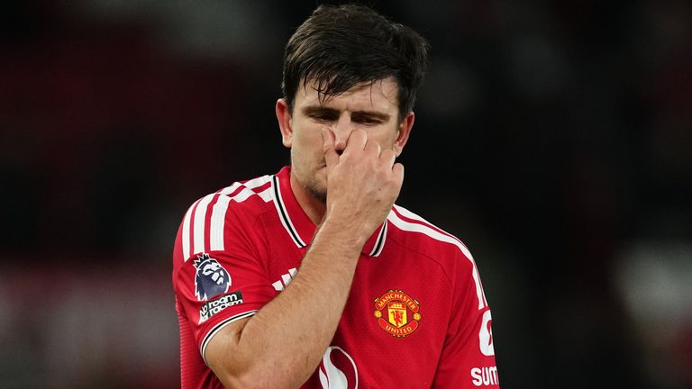 Harry Maguire shows his dejection as he leaves the pitch