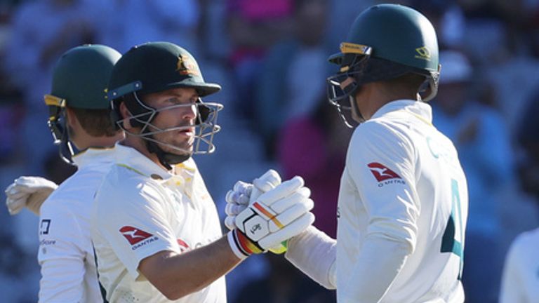 Australia's Josh Inglis, left, congratulated by Australia's Alex Carey 