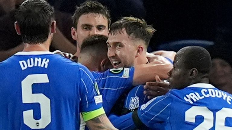 Brighton and Hove Albion's Jack Hinshelwood (second right) is embraced by his team-mates