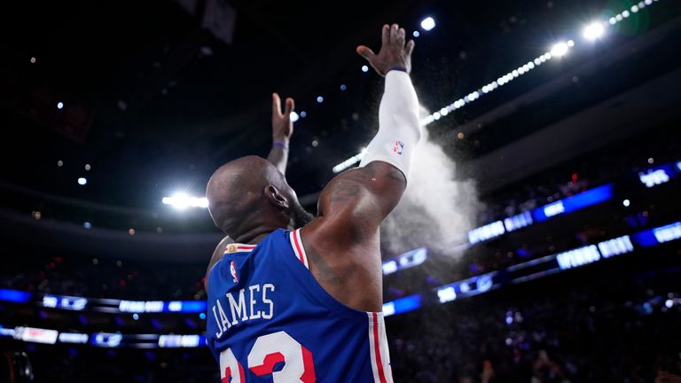 James throws chalk into the air before the Cavs game