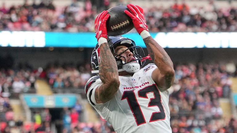 Houston Texans wide receiver Jaylin Noel (13) matches a catch to score a touchdown during an NFL football game against Jacksonville Jaguars in London, Sunday, Oct. 18, 2026. (AP Photo/Kin Cheung)