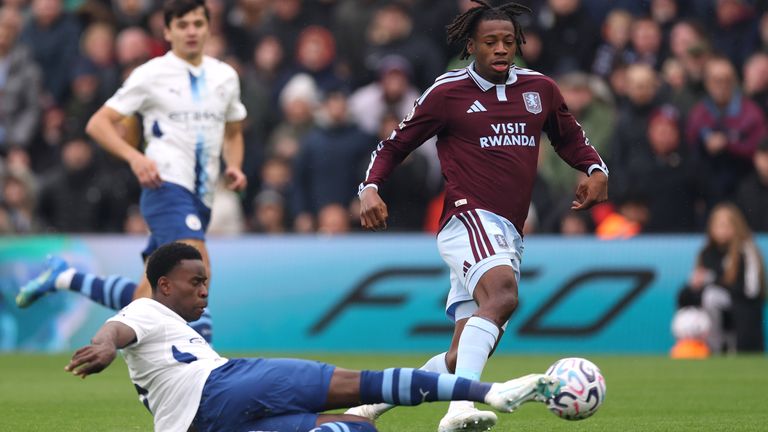 Johan Manzambi of Aston Villa is tackled by Marc Guehi of Manchester City