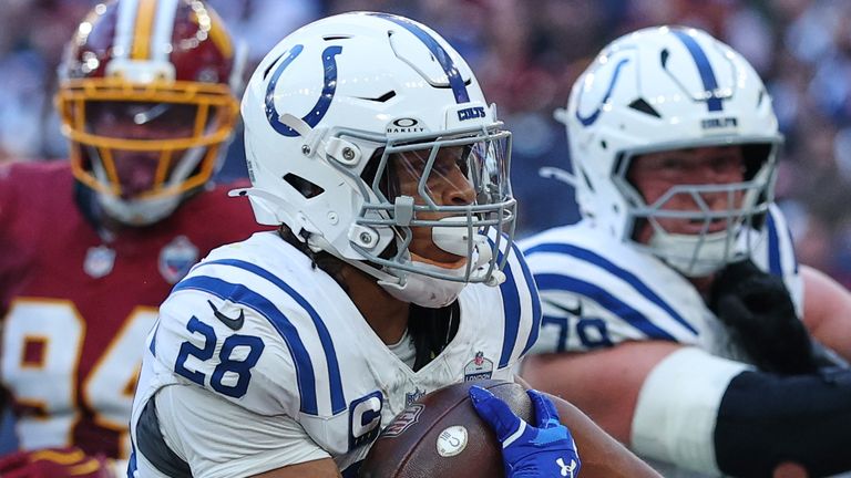 Indianapolis Colts running back Jonathan Taylor (28) runs into the end zone to scores his side's second touchdown during an NFL football game against Washington Commanders in London, Sunday, Oct. 4, 2026. (AP Photo/Ian Walton)