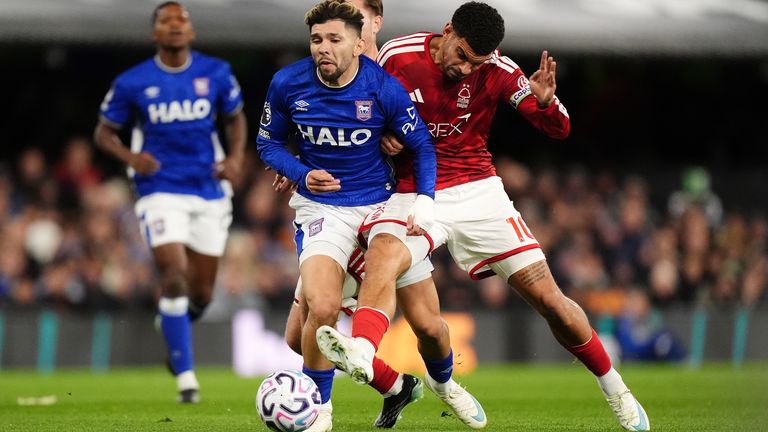 Julio Enciso and Morgan Gibbs-White tussle for the ball