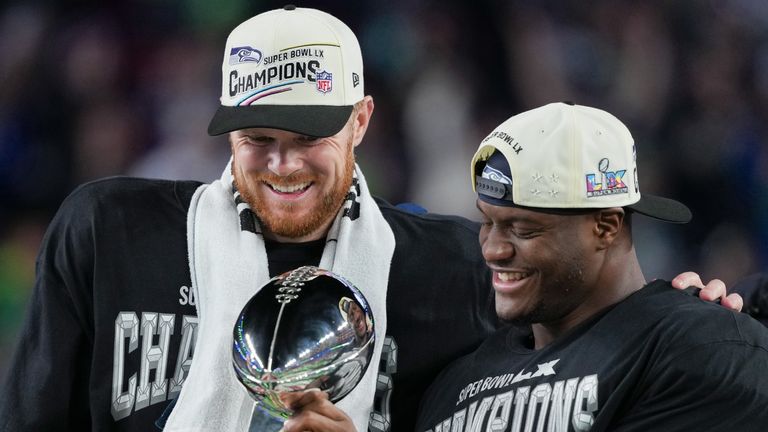 Seattle Seahawks quarterback Sam Darnold and running back Kenneth Walker III celebrate after their Super Bowl win at Levi's Stadium