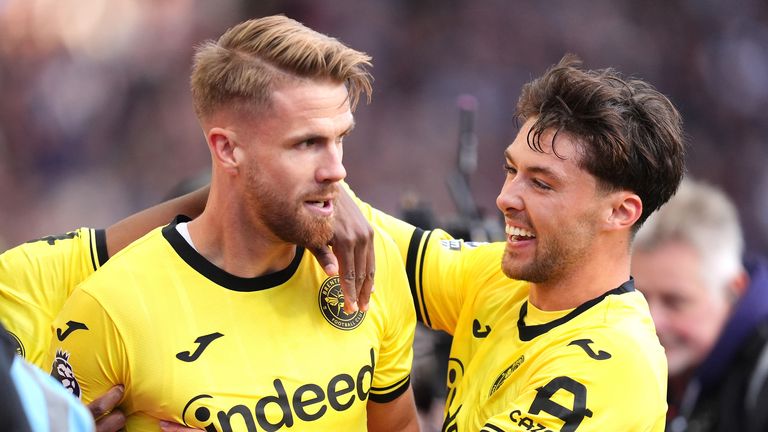 Brentford's Kristoffer Ajer celebrates with Aaron Hickey after making it 2-2 at Villa Park