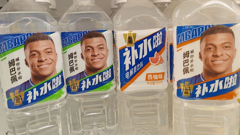 A view of bottles of electrolyte beverage featuring soccer player Kylian Mbappe in China