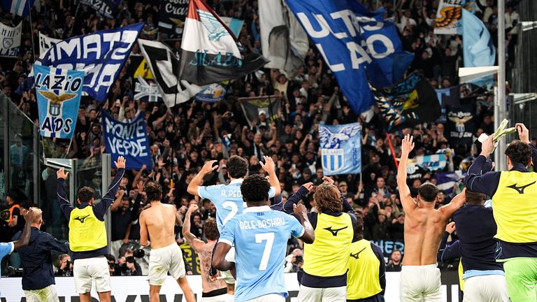 Lazio players celebrate with supporters following the win over Juventus in Turin