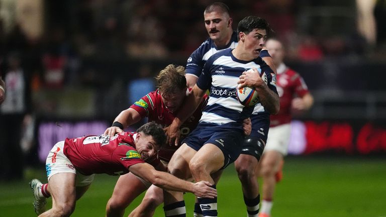 Bristol Bears' Louis Rees-Zammit is tackled by Leicester Tigers' Adam Radwan