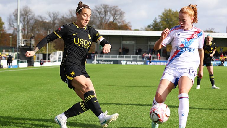 SUTTON, ENGLAND - OCTOBER 25: Lucy Bronze of Chelsea passes the ball under pressure from Annabel Blanchard of Crystal Palace during the Barclays Women's Super League 2026/27 match between Crystal Palace FC and Chelsea FC at VBS Community Stadium on October 25, 2026 in Sutton, England. (Photo by Sarah Ray-Gain/Getty Images)