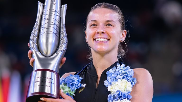 Maja Chwalinska celebrates with her trophy after defeating Sonay Kartal at the Wuhan Open