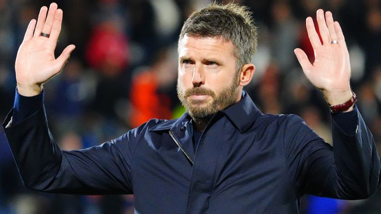 Michael Carrick holds his hands up to apologise to Man Utd's travelling supporters after thir 4-1 defeat by Como