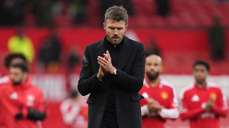 Michael Carrick applauds the fans after the heavy defeat to Bournemouth at Old Trafford