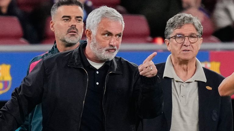 Real Madrid's head coach Jose Mourinho, left, argues with Referee Juan Martinez Munuera against Barcelona
