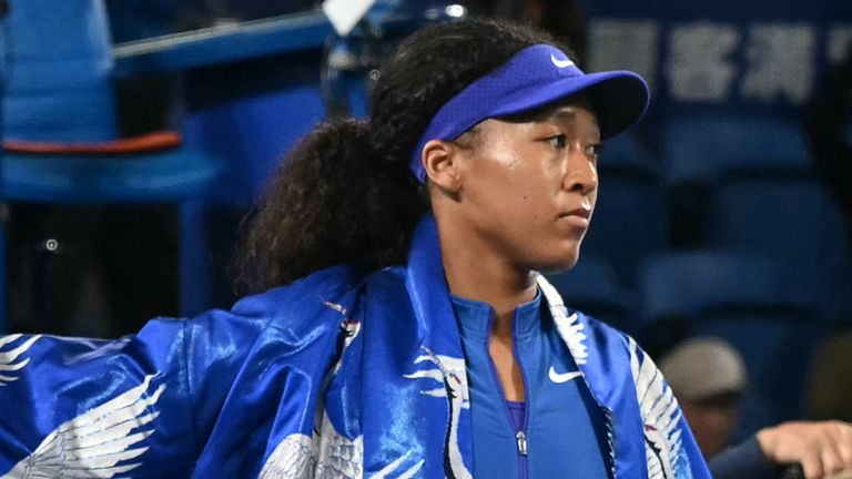 Japan's Naomi Osaka walks onto the court ahead of her WTA Pan Pacific Open tennis tournament match against Italy's Jasmine Paolini 