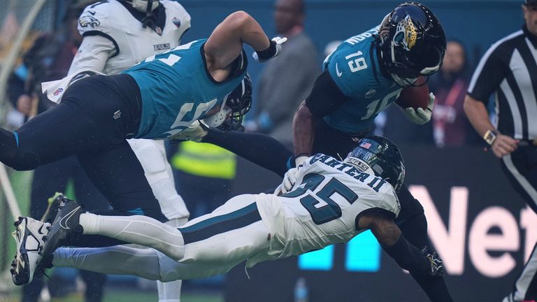 Jacksonville Jaguars wide receiver Josh Cameron (19) races to score a touchdown that was disallowed on a flag during an NFL football game in London, Sunday, Oct. 11, 2026. (AP Photo/Alastair Grant)