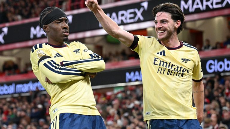 Noni Madueke celebrates with Declan Rice after scoring for Arsenal at the City Ground
