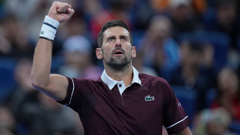 Novak Djokovic, of Serbia, reacts after winning the second set against Alexander Zverev, of Germany, during the men's singles quarterfinals 