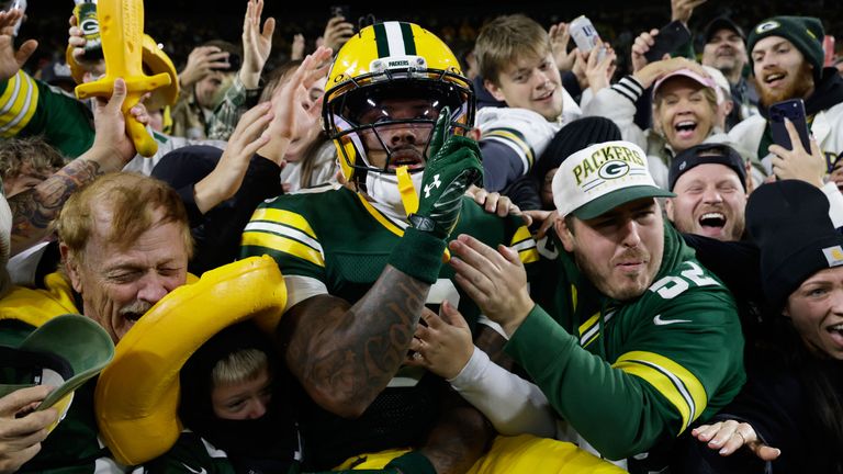 Green Bay Packers wide receiver Golden leaps into the stands as he celebrates scoring a touchdown 