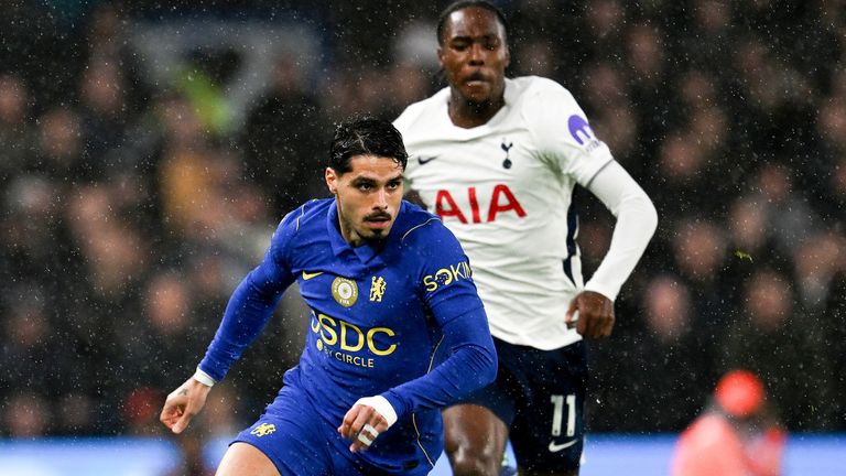 Pedro Neto runs with the ball under pressure from Mathys Tel 