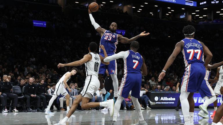 Philadelphia 76ers' LeBron James (23) grabs a rebound during the first half of a preseason NBA basketball game against the Brooklyn Nets, Thursday, Oct. 8, 2026, in New York