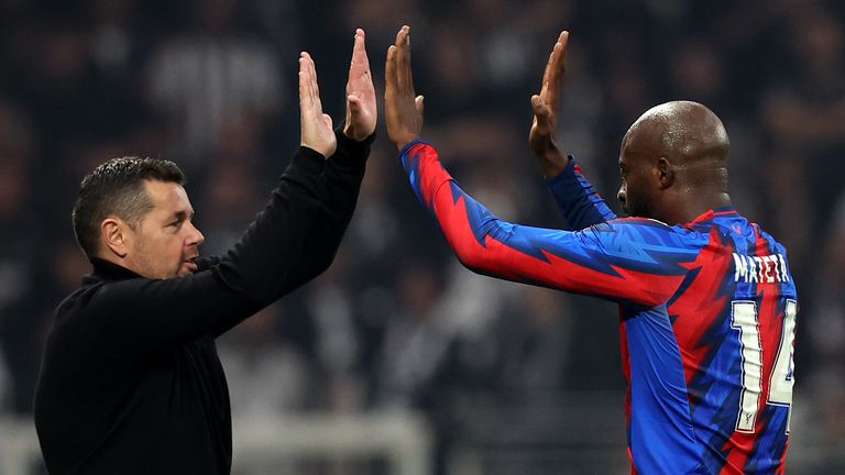 Pierre Sage celebrates with Crystal Palace strike Jean-Philippe Mateta