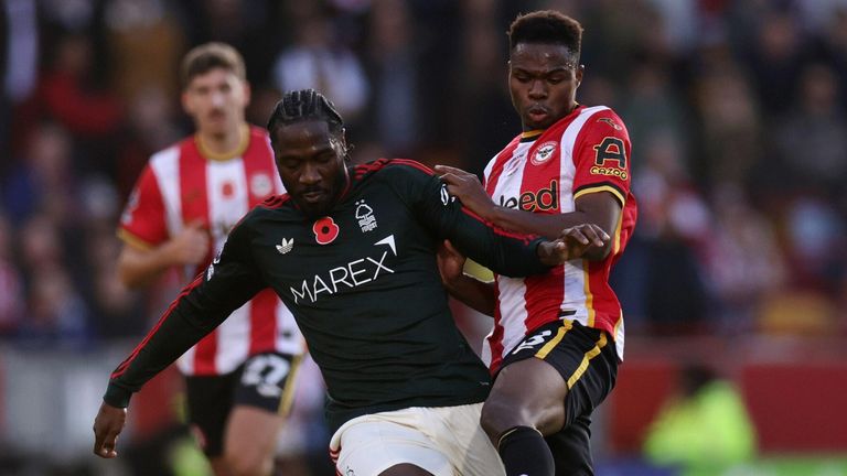 Ola Aina and Mamadou Sangare (right) battle for the ball 