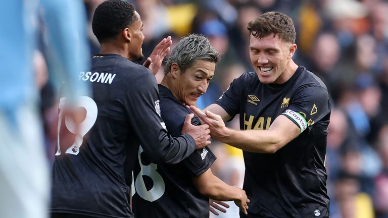 Daizen Maeda celebrates team-mates Emersonn and Dara O'Shea after equalising for Ipswich at the Etihad
