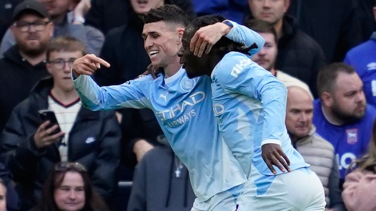 Phil Foden celebrates with his teammate Jeremy Doku after giving Man City the lead against Ipswich