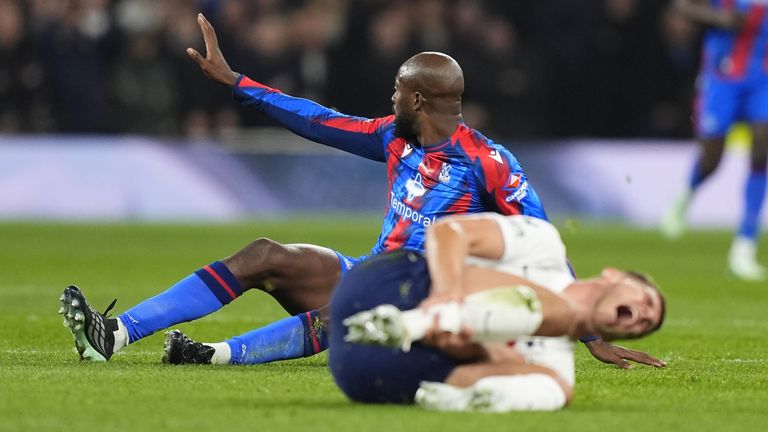 Micky van de Ven writhes in pain following a reckless challenge by Jean-Philippe Mateta
