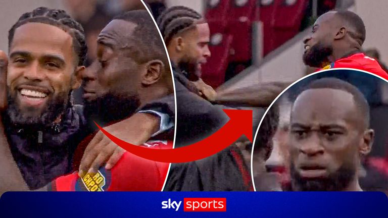 Heated moment between players after match.