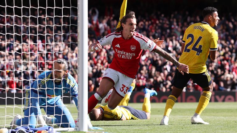 Riccardo Calafiori wheels away after levelling for Arsenal