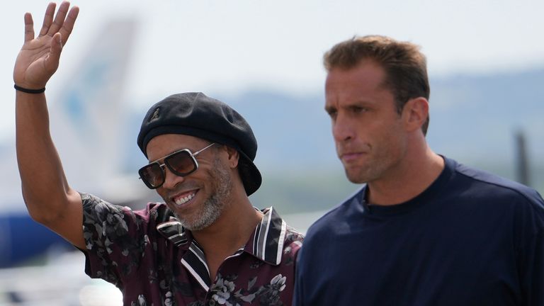 Former soccer star Ronaldinho, flanked by Ravenna president Ignazio Cipriani, right, arrives at the airport ahead the Ravenna Serie C, 2026 soccer team presentation, joining the club as a technical coach and playing in one match in Ravenna, Italy, Th