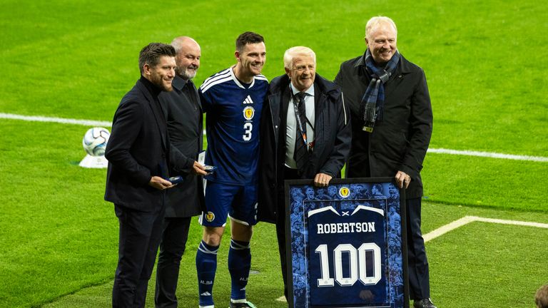 Pocognoli, Steve Clarke, Gordon Strachan and Alex McLeish presented Andy Robertson with a special jersey