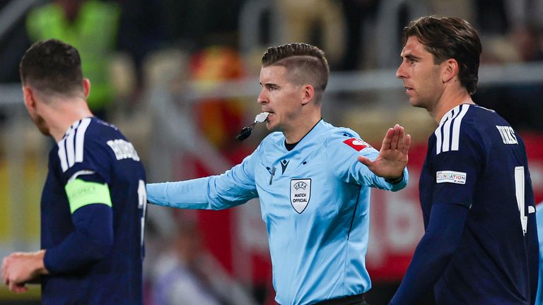 Referee Francois Letexier overturns Scotland's penalty decision