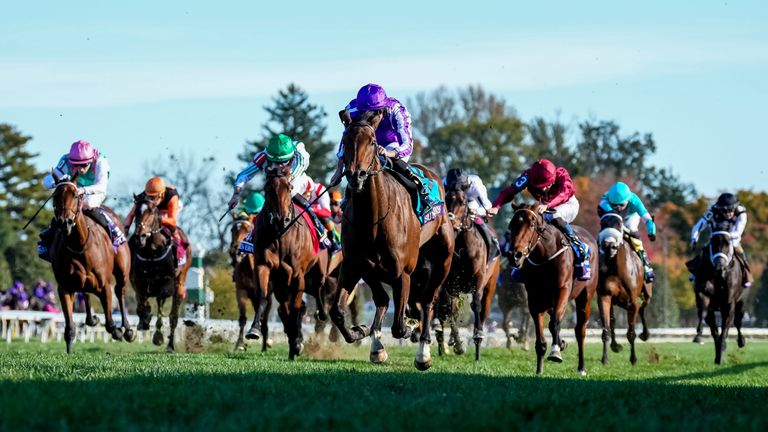 Sun Goddess (9), ridden by jockey Ryan Moore, wins the John Deere Breeders' Cup Juvenile Fillies Turf at Keeneland